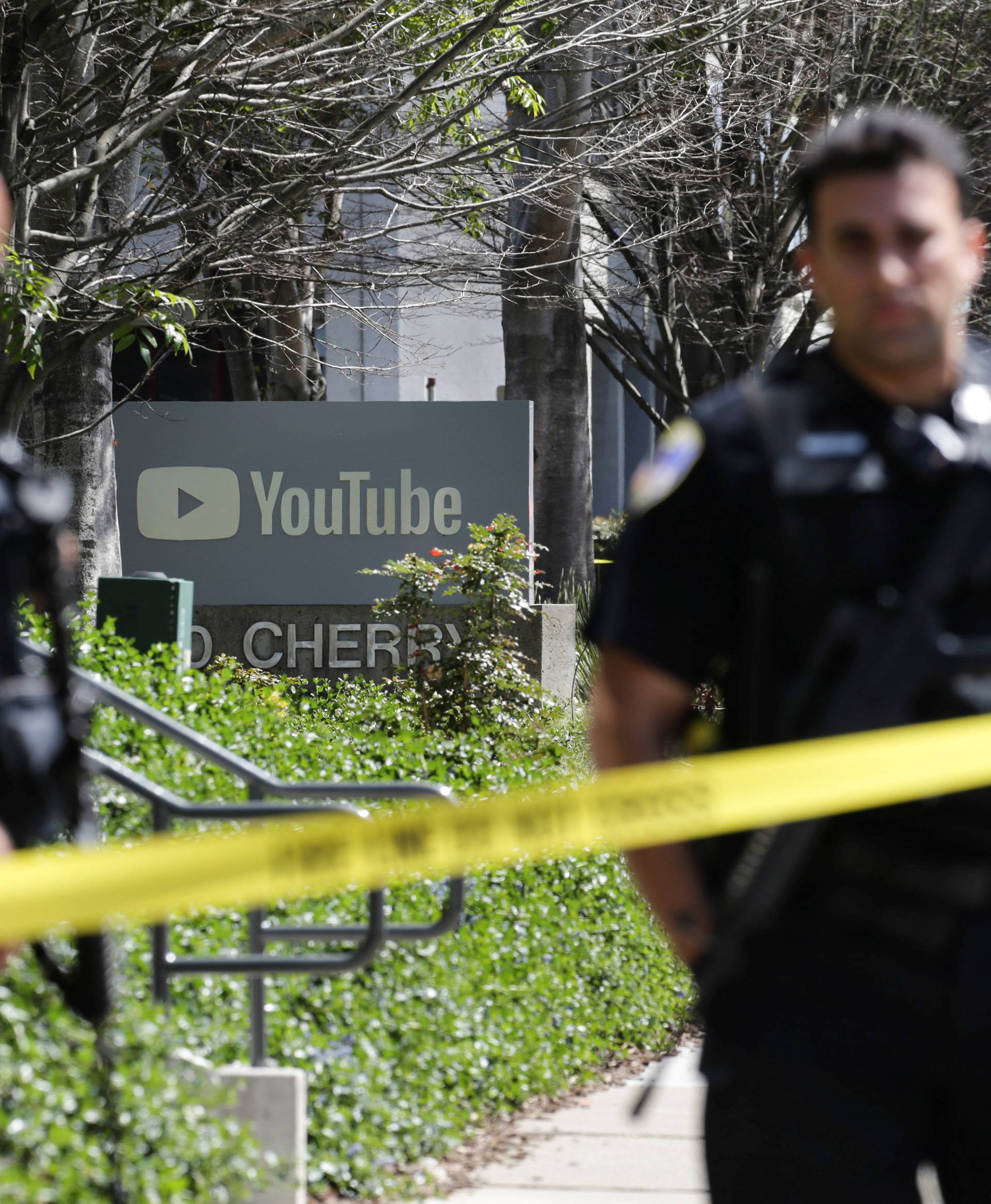 Police officers and crime scene tape are seen at Youtube headquarters following an active shooter situation in San Bruno, California