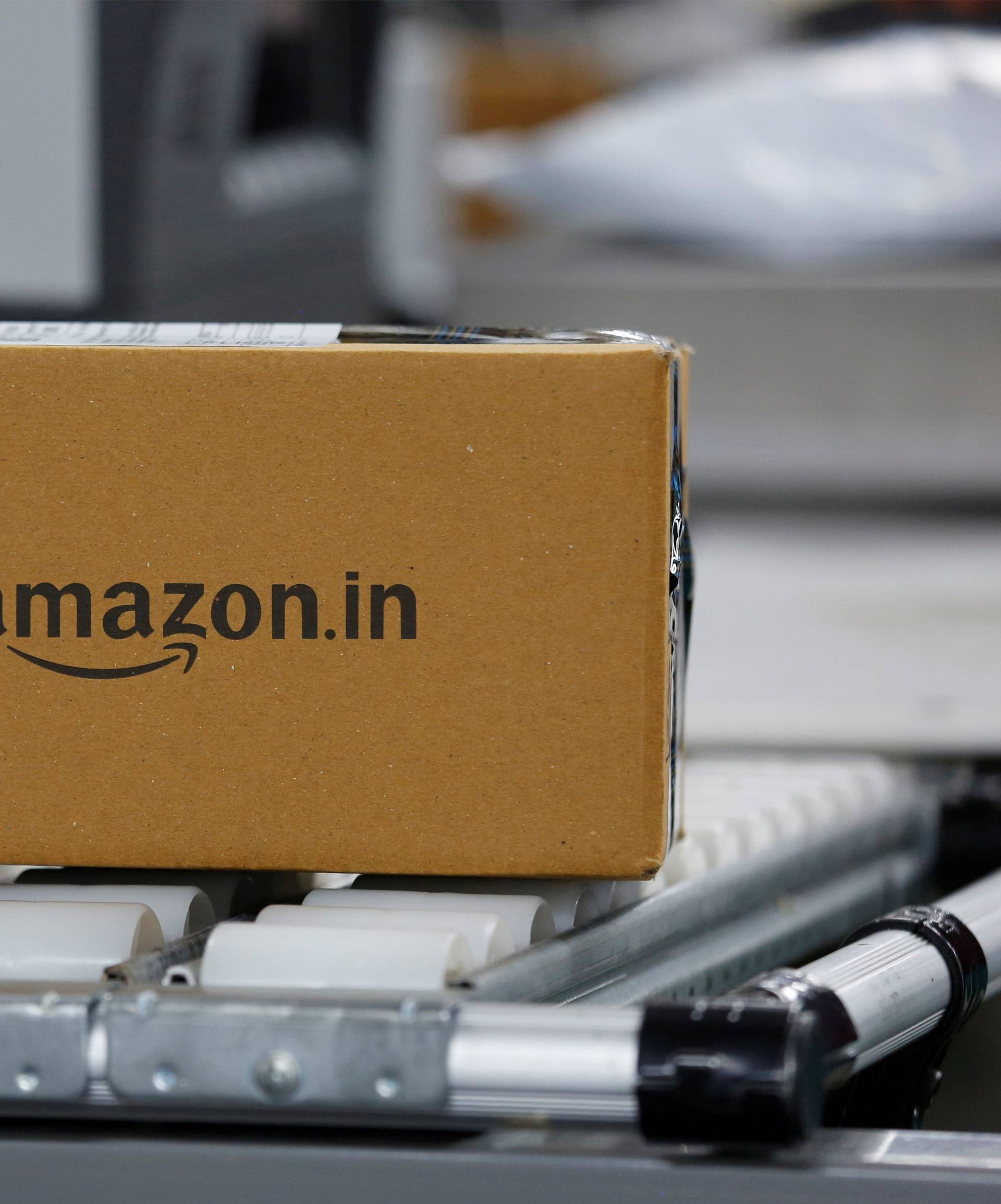 FILE PHOTO: A shipment moves on a conveyor belt at an Amazon Fulfillment Centre