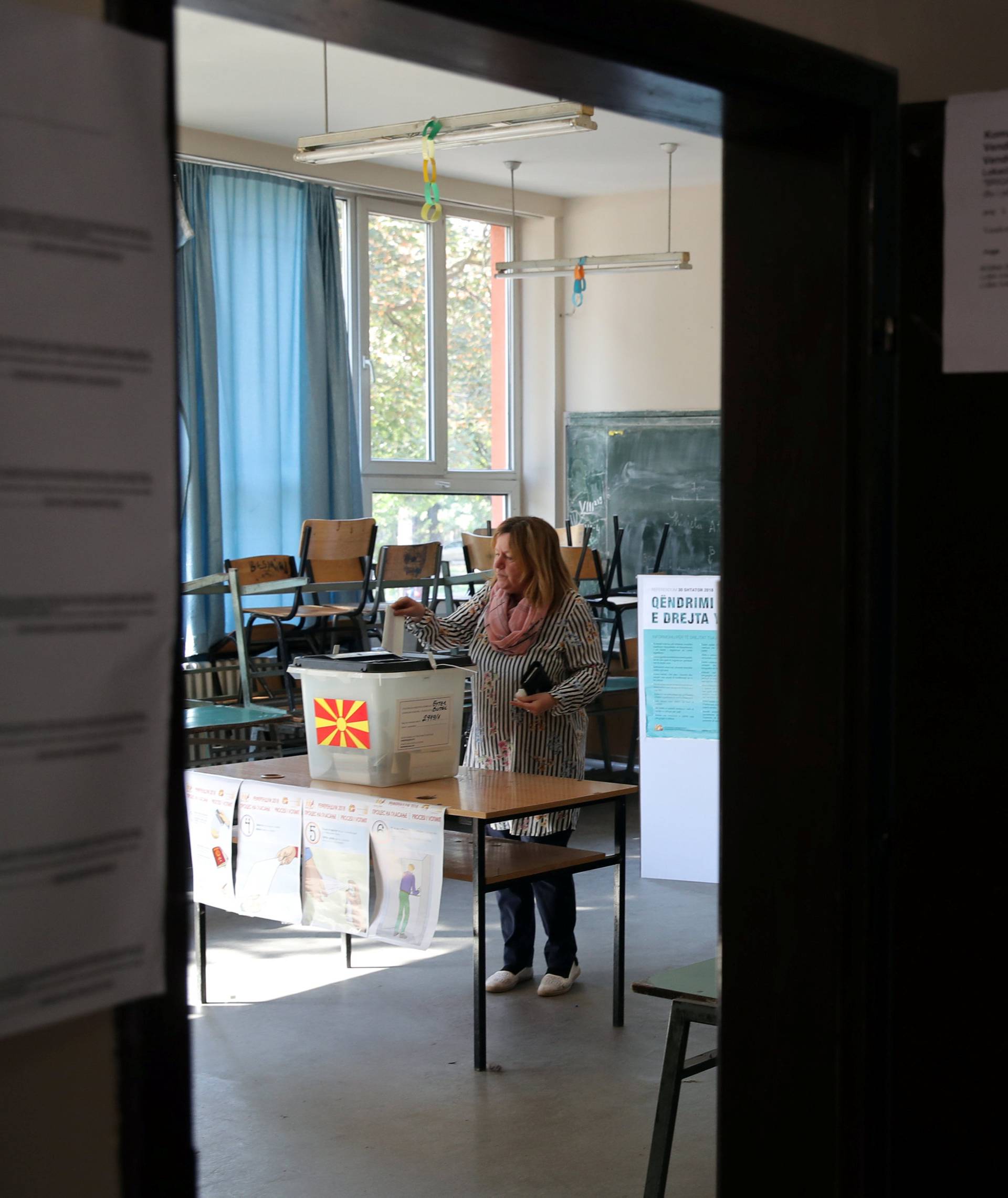 A woman casts her ballot for the referendum in Macedonia on changing the country's name that would open the way for it to join NATO and the European Union in Skopje