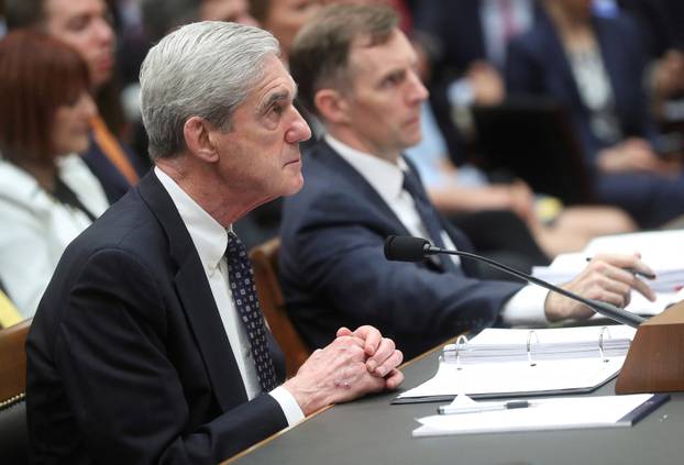 FILE PHOTO: Former Special Counsel Robert Mueller testifies during House Intelligence Committee hearing on the Mueller Report on Capitol Hill in Washington