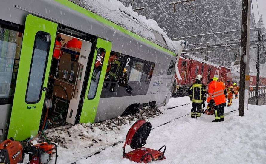 A Swiss BLS train surrounded by snow following a derailment