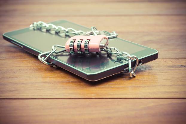 Vintage,Image,Of,Pink,Padlock,And,Chain,On,Mobile,smart,Phone,tablet,cell