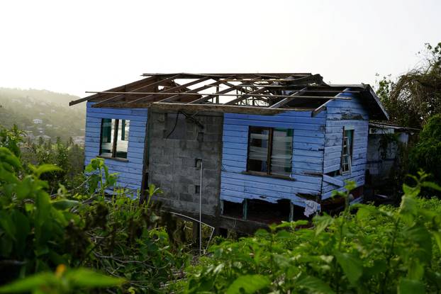 Damaged house missing its roof after Hurricane Beryl passed Grenada