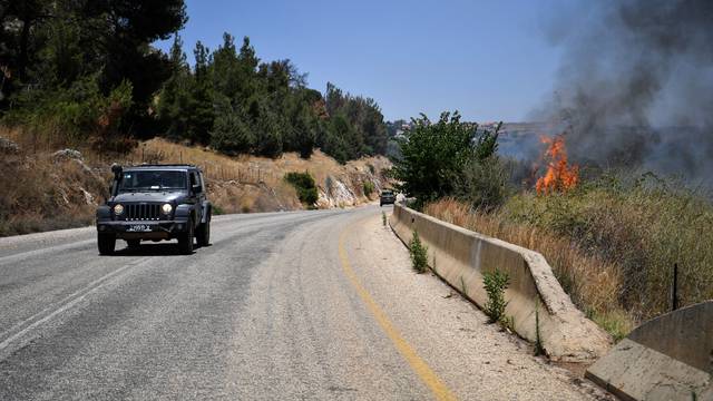 A fire blazes on the Israeli side of the Israel-Lebanon border following attacks from Lebanon, amid cross-border hostilities between Hezbollah and Israeli forces