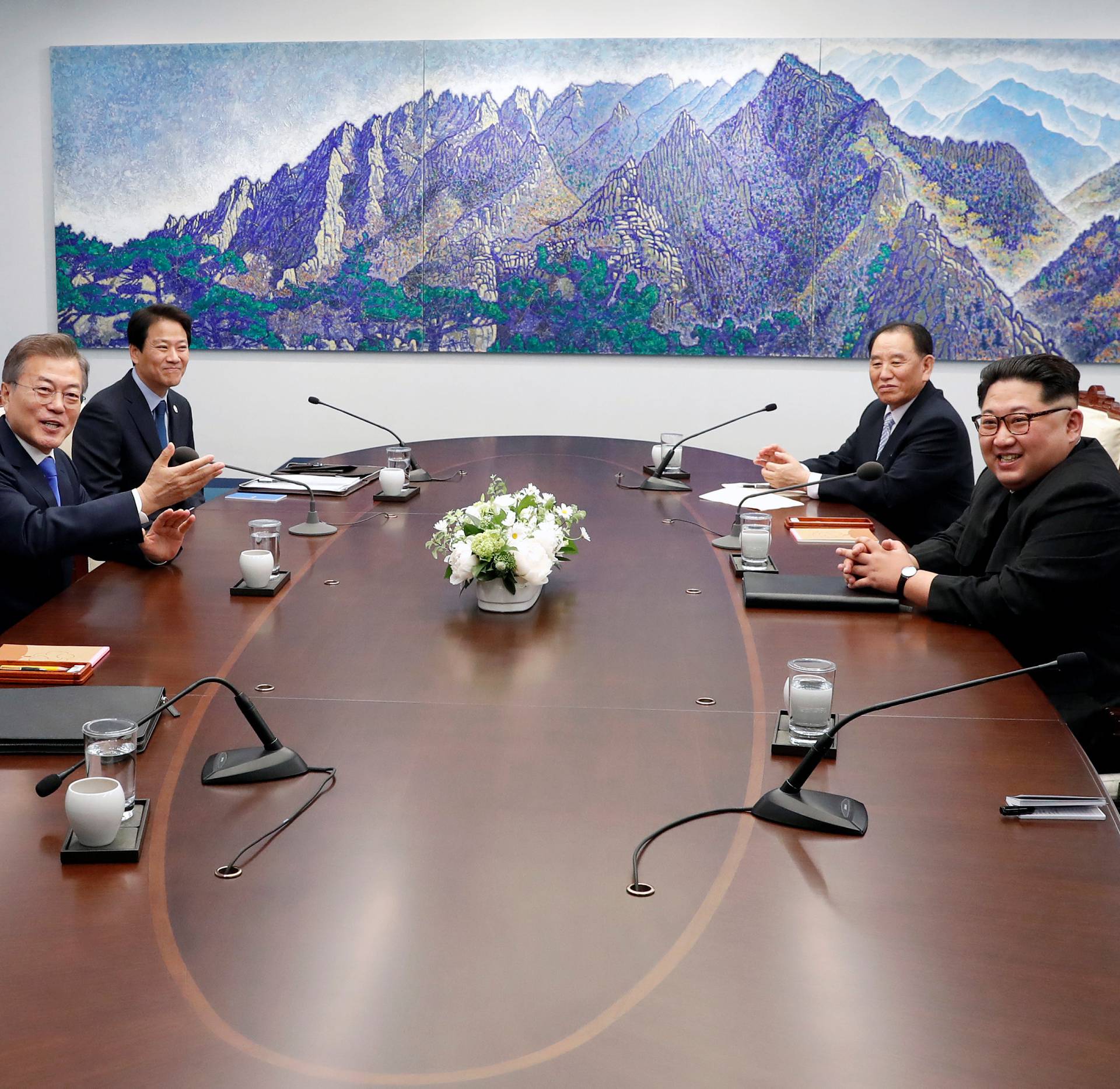 South Korean President Moon Jae-in talks with North Korean leader Kim Jong Un during their meeting at the Peace House