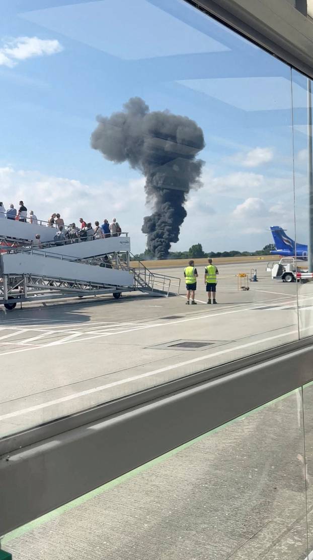 A plume of black smoke rises near Southend runway following small plane crash