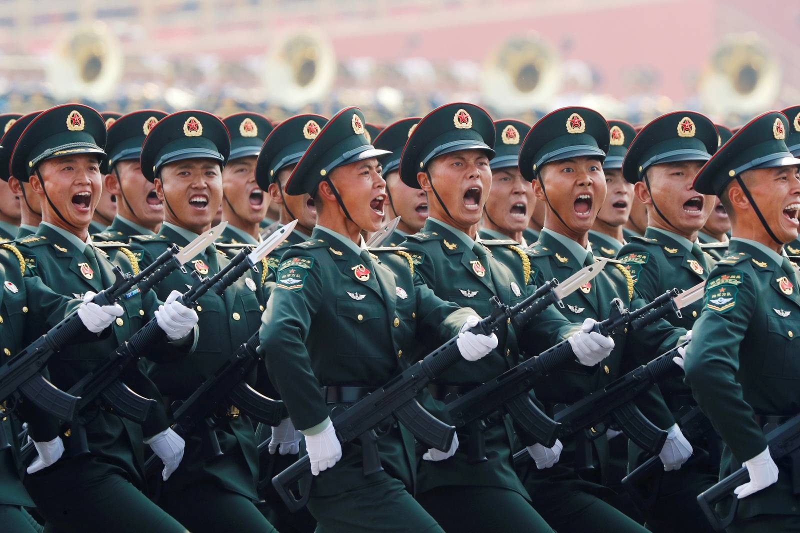 Soldiers of People's Liberation Army (PLA) march in formation during the military parade marking the 70th founding anniversary of People's Republic of China