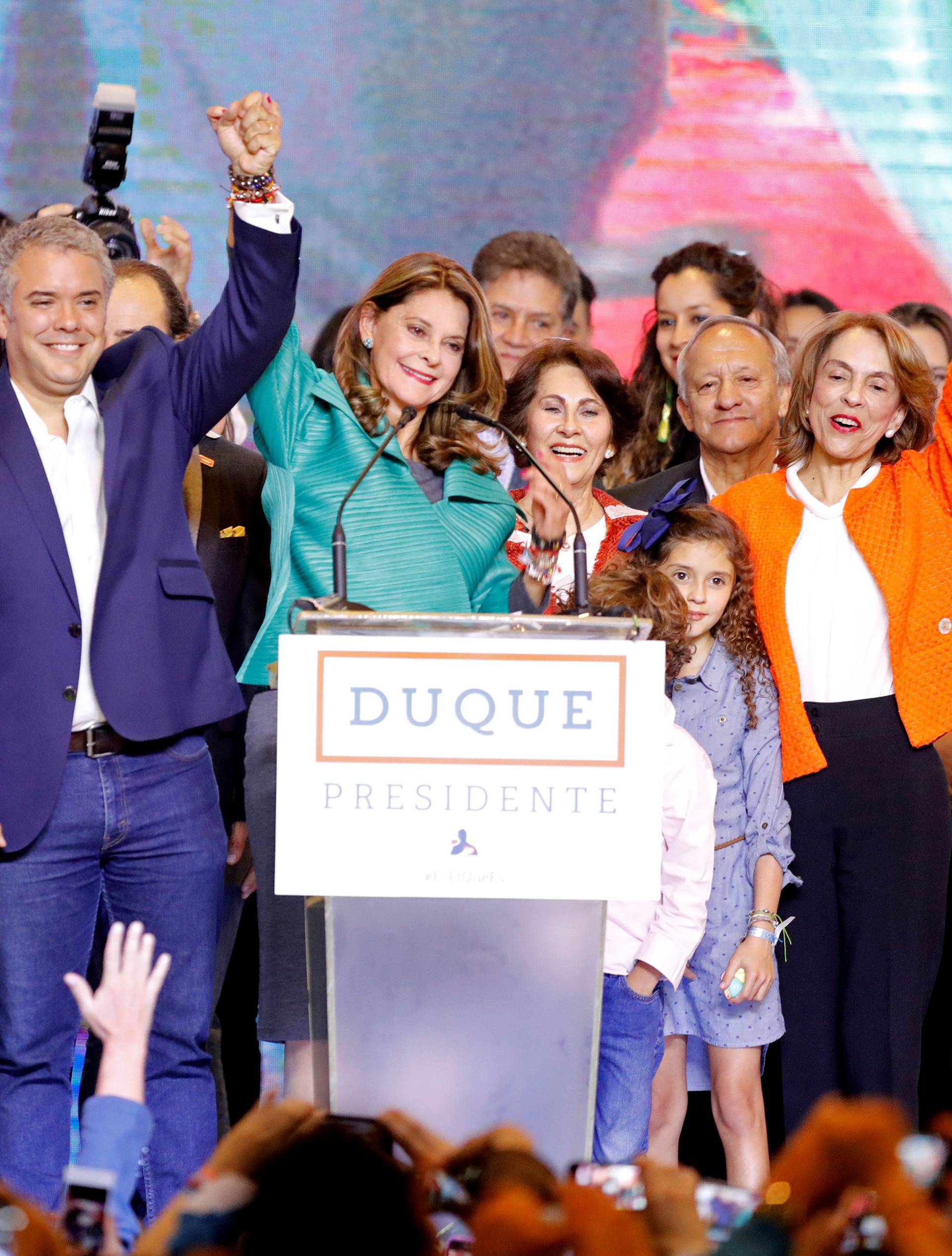 Presidential candidate Duque celebrates with his candidate for Vice President Ramirez after he won the presidential election in Bogota