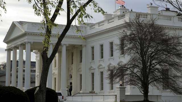 FILE PHOTO: The U.S. flag flies at half-staff at the White House in Washington