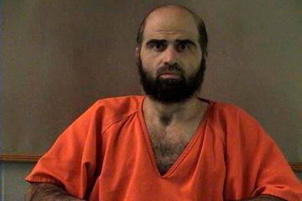 FILE PHOTO: Handout photo of Nidal Hasan, charged with killing 13 people and wounding 31 in a November 2009 shooting spree at Fort Hood.