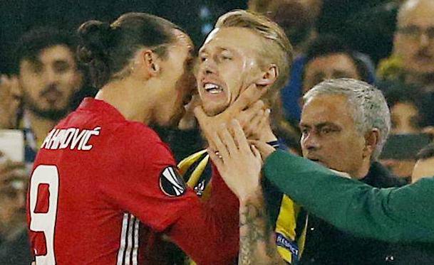 Manchester United's Zlatan Ibrahimovic clashes with Fenerbahce's Simon Kjaer as manager Jose Mourinho looks on