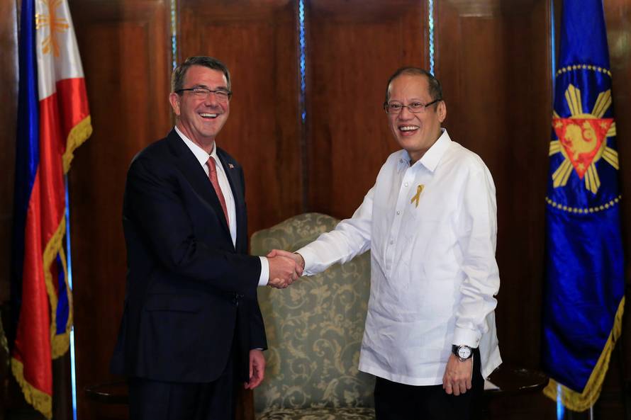 President of the Philippines Benigno Aquino greets visiting U.S. Defense Secretary Ash Carter at the presidential palace in Manila