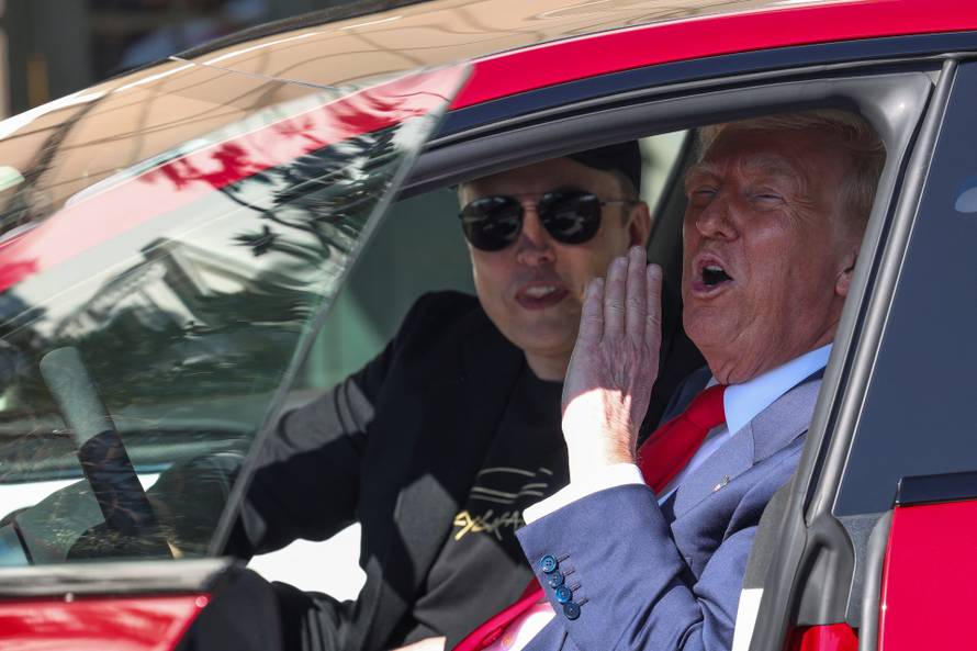U.S. President Donald Trump views a Tesla car at the White House in Washington