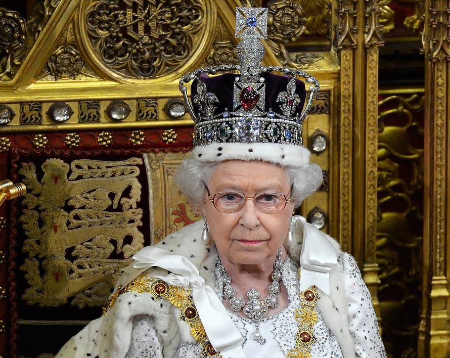 FILE PHOTO: Britain's Queen Elizabeth waits before delivering her speech in the House of Lords, during the State Opening of Parliament at the Palace of Westminster in London