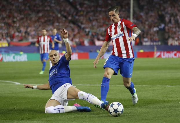 Leicester City's Yohan Benalouane in action with Atletico Madrid's Fernando Torres