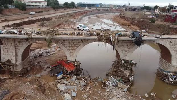 Drone shows rehabilitation work under way at destroyed bridge in Spain