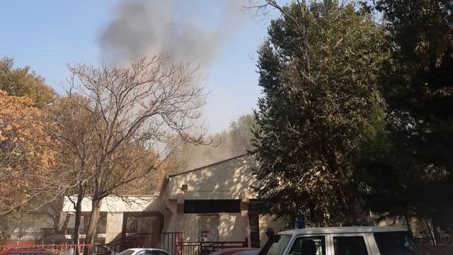 Smoke billows near military hospital after an explosion in Kabul