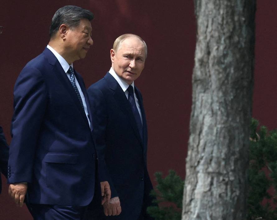 FILE PHOTO: Russian President Vladimir Putin meets with Chinese President Xi Jinping in Beijing