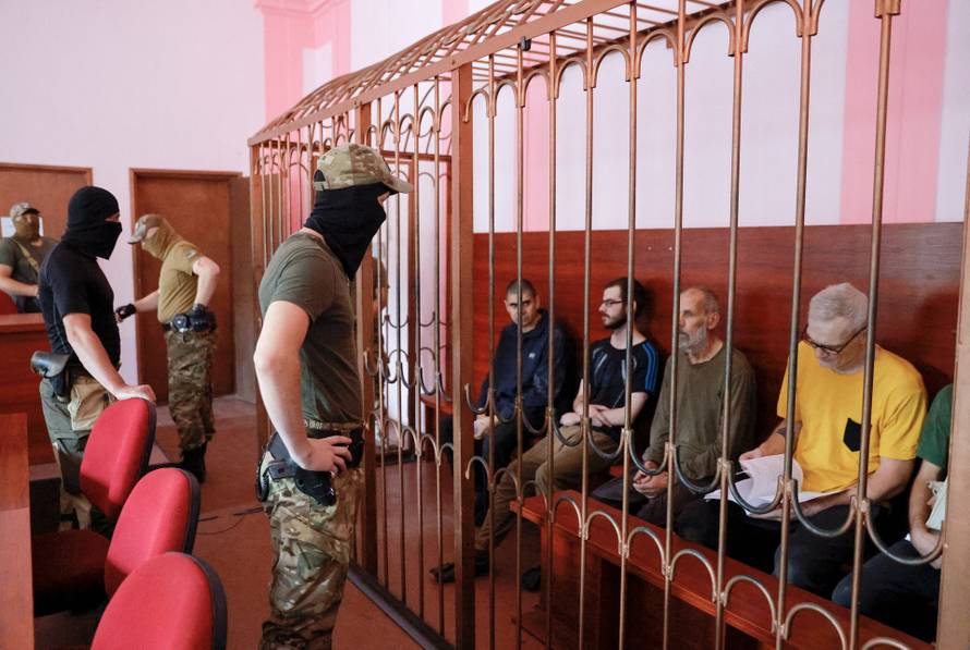 Foreign nationals captured during Ukraine-Russia conflict attend a court hearing in Donetsk