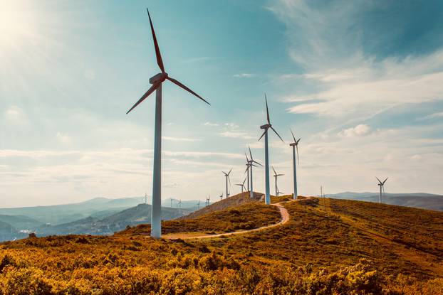 Wind,Turbines,On,Beautiful,Sunny,Summer,Autumn,Mountain,Landsape.,Curvy