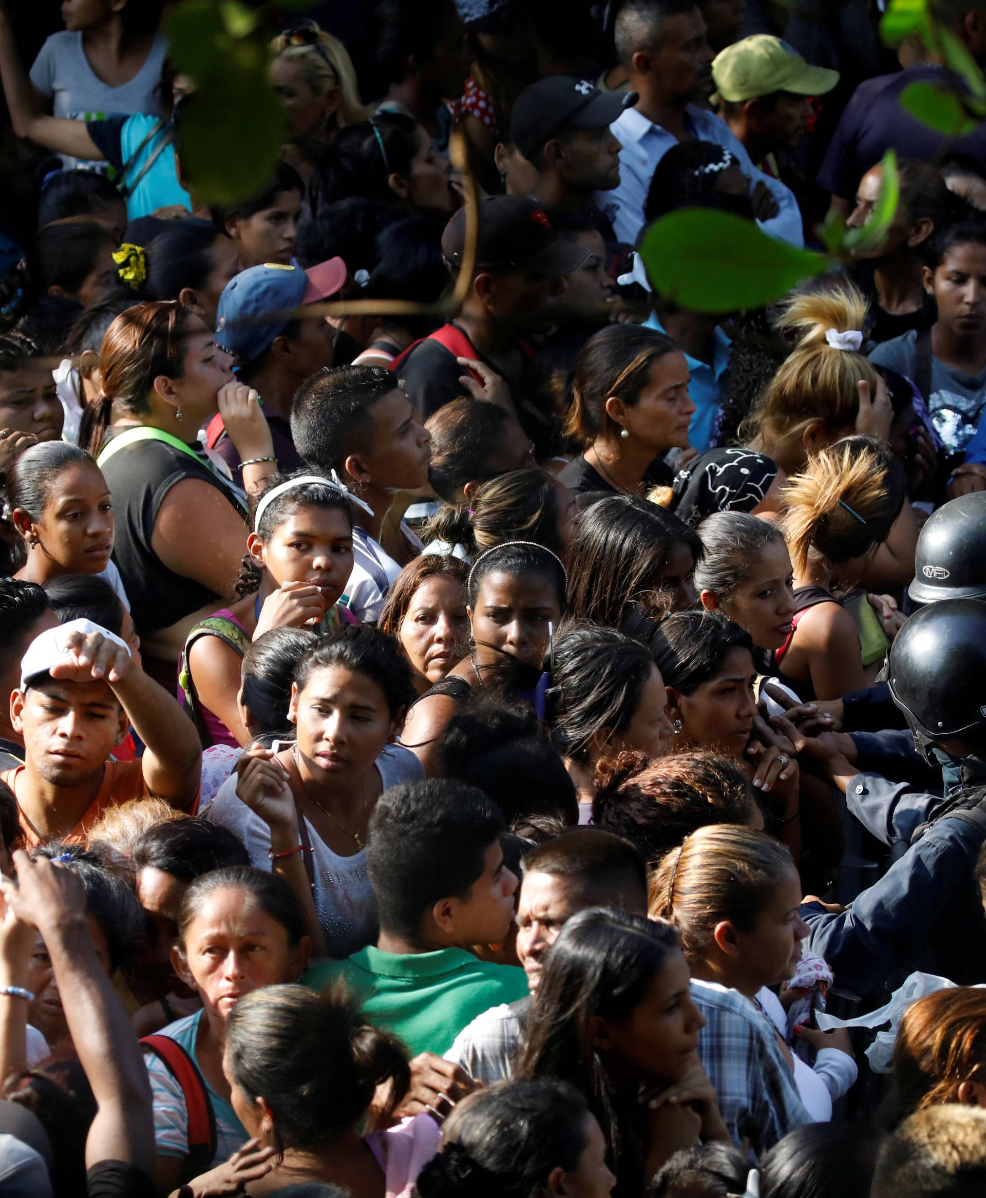 Relatives of inmates at the General Command of the Carabobo Police wait outside the prison in Valencia