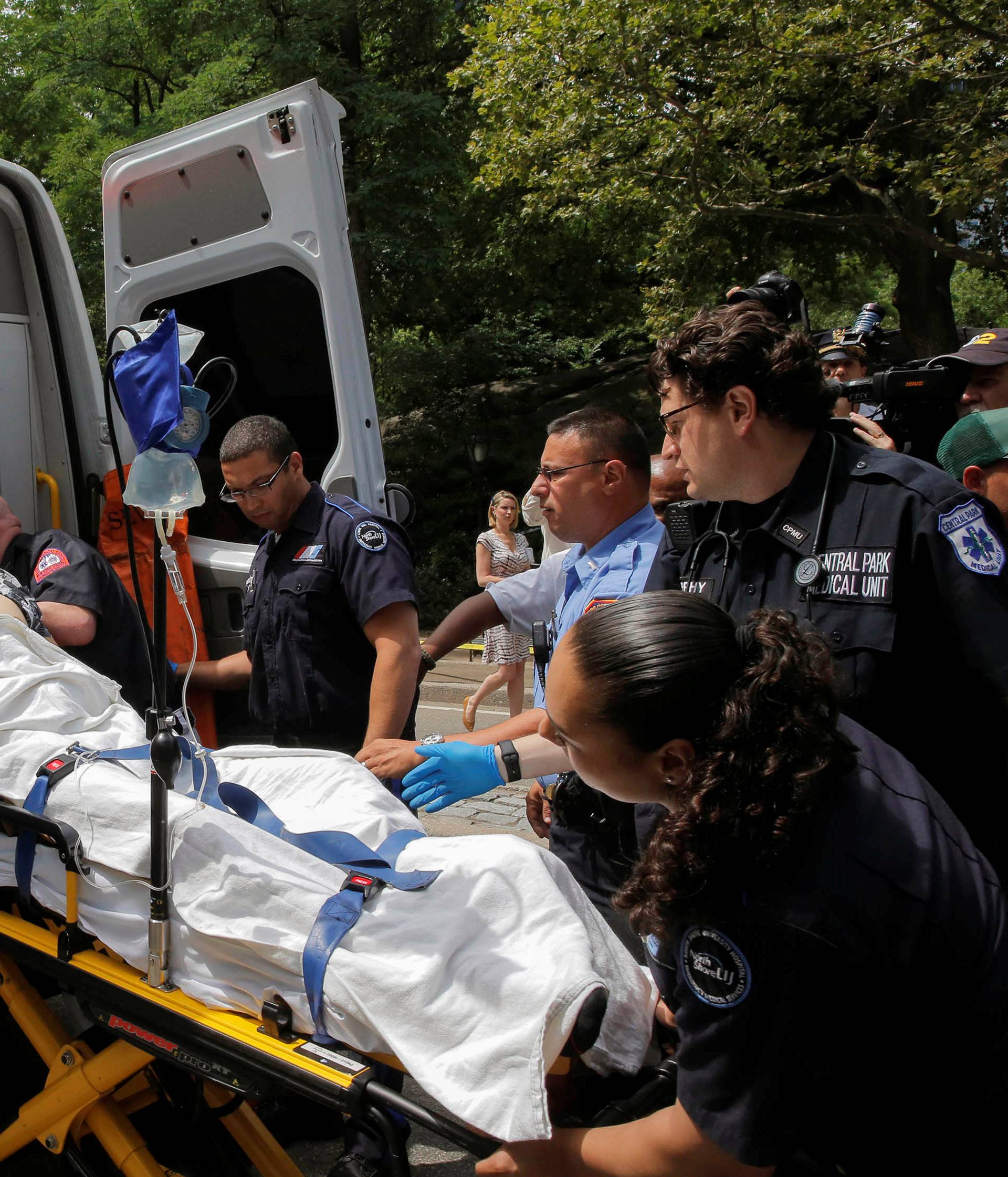 Man is loaded into ambulance after explosion in Central Park, in Manhattan, New York