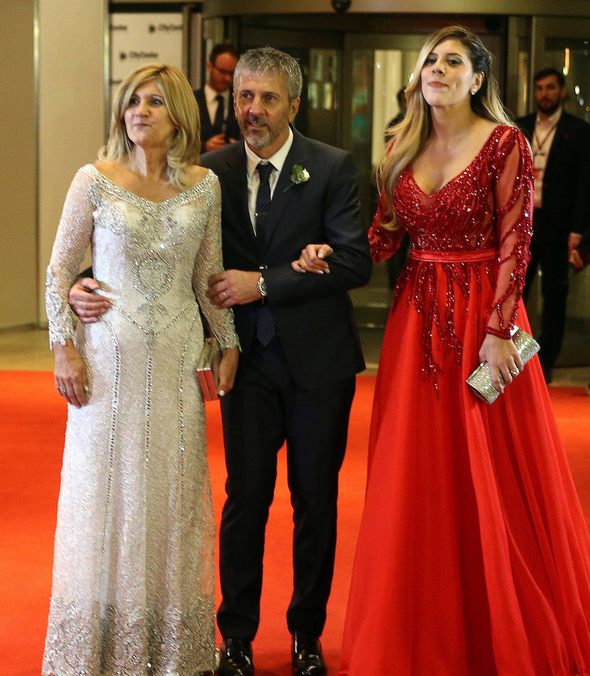 Argentine soccer player Lionel Messi's parents Jorge and Celia and his sister Maria Sol pose at his wedding to Antonela Roccuzzo in Rosario