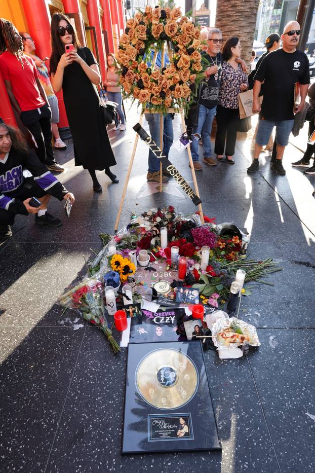 Flowers and pictures are placed on the star of late Ozzy Osbourne at the Hollywood Walk of Fame in Los Angeles