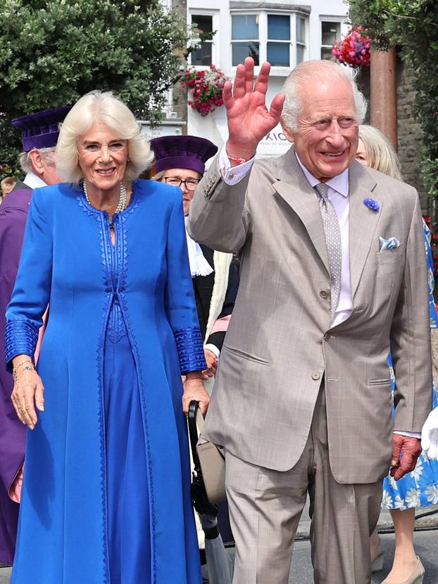 Queen Camilla and King Charles III meeting well-wishers as they arrive to attend the special sitting of the States of Deliberation, at the Guernsey Parliament in Saint Peter Port, Guernsey, during a two day visit to the Channel Islands. Picture date: Tues