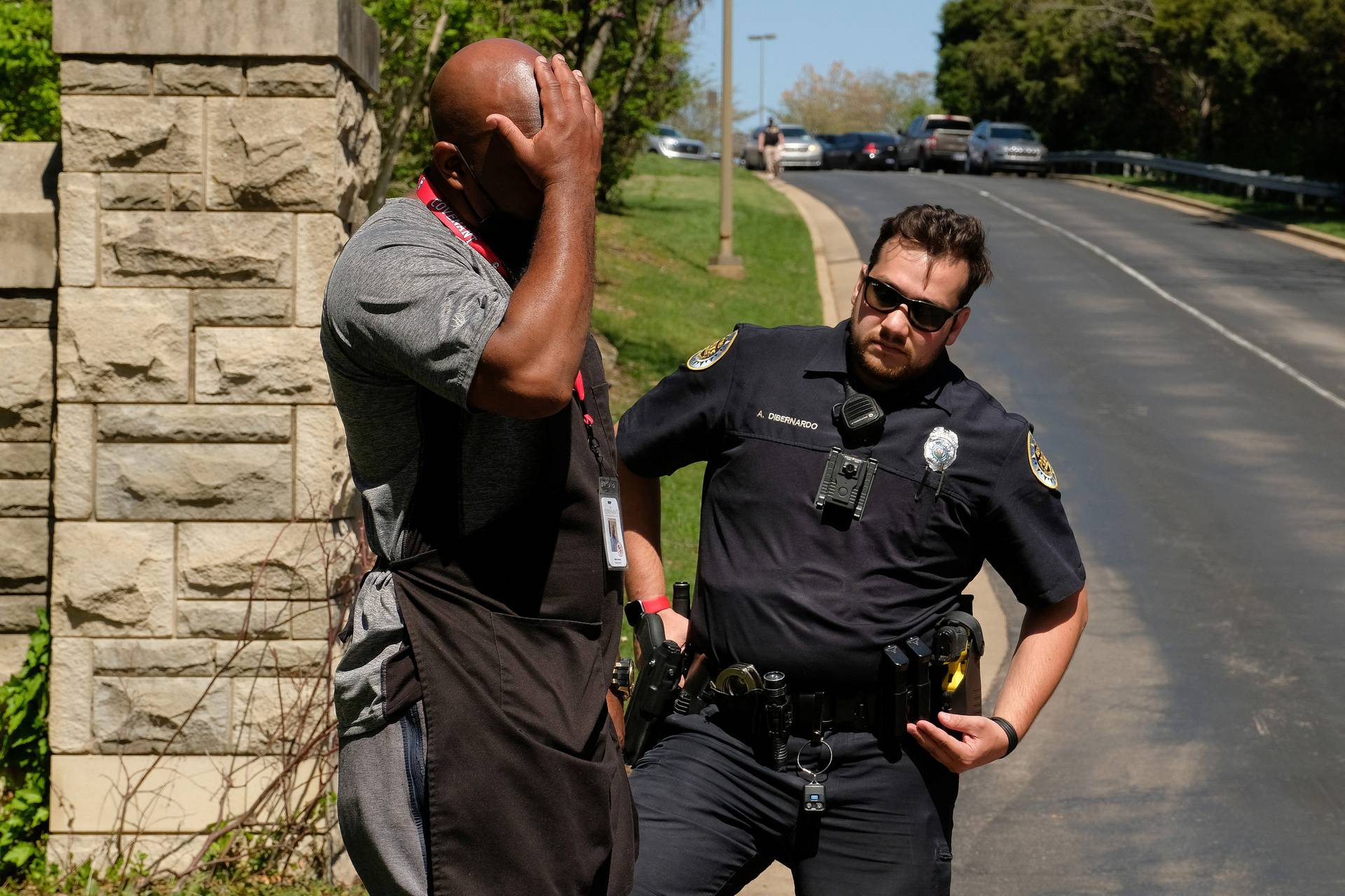 Mario Dennis, one of the kitchen staff at the Covenant School, reacts after a shooting in Nashville