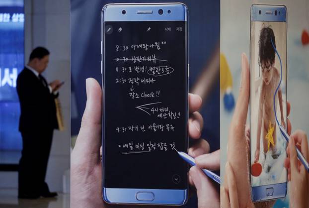 A man uses his mobile phone next to advertisements promoting Samsung Electronics