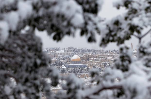 FILE PHOTO: Snow covers the Dome of the Rock in Jerusalem