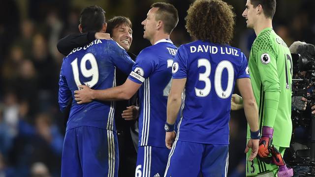 Chelsea's Diego Costa and John Terry celebrate with Chelsea manager Antonio Conte after the match