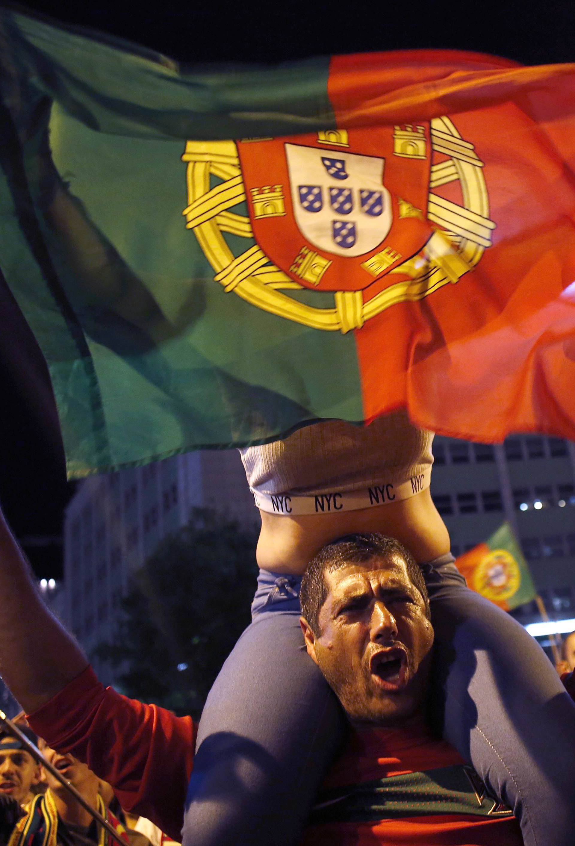 Fans of Portugal react after the Euro 2016 final between Portugal and France in Lisbon