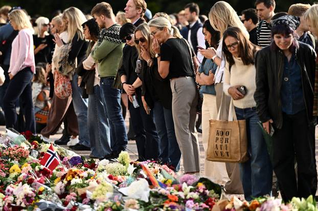 People gather outside the Royal Palace, following the death of Norway's King Harald, in Oslo