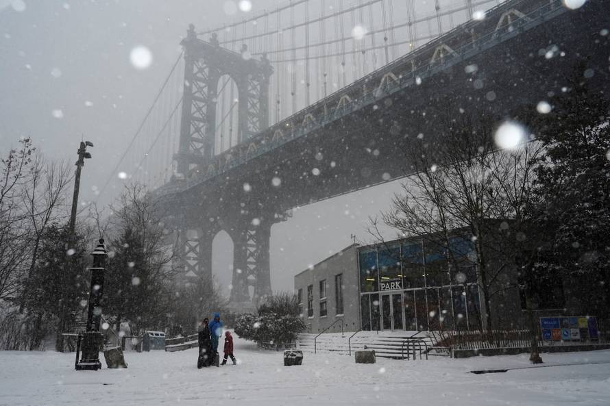 A family visits at Brooklyn Bridge Park