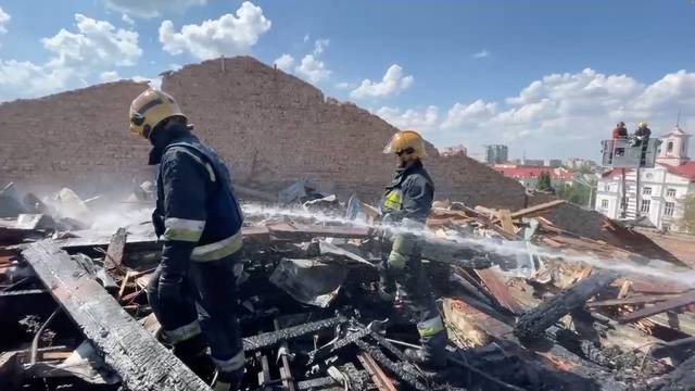 Rescuers from State Emergency Service of Ukraine work on the site hit by a Russian rocket strike, in Chernihiv
