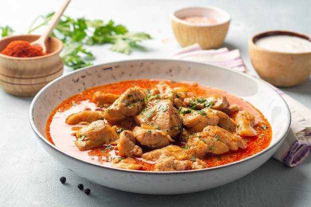 Chicken,Stew,With,Paprika,,Onion,And,Sour,Cream,In,Plate