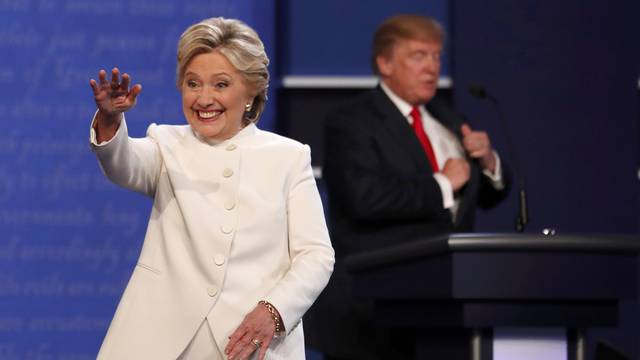 Democratic U.S. presidential nominee Clinton walks off the debate stage as Republican U.S. presidential nominee Trump remains at his podium after the conclusion of their third and final 2016 presidential campaign debate in Las Vegas