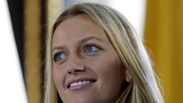 FILE PHOTO: Czech Republic's Petra Kvitova smiles during the draw for the Fed Cup final in Prague