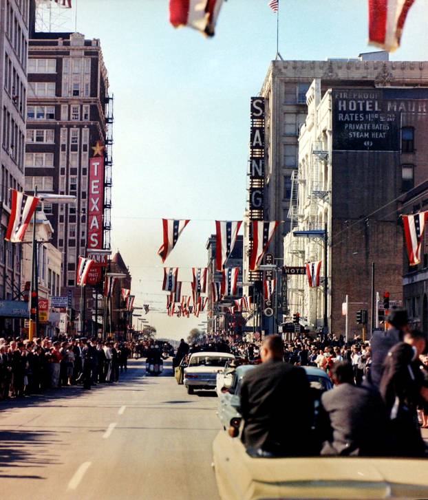 FILE PHOTO: The motorcade carrying President John F. Kennedy rolls through the streets of Dallas, Texas minutes before his assassination