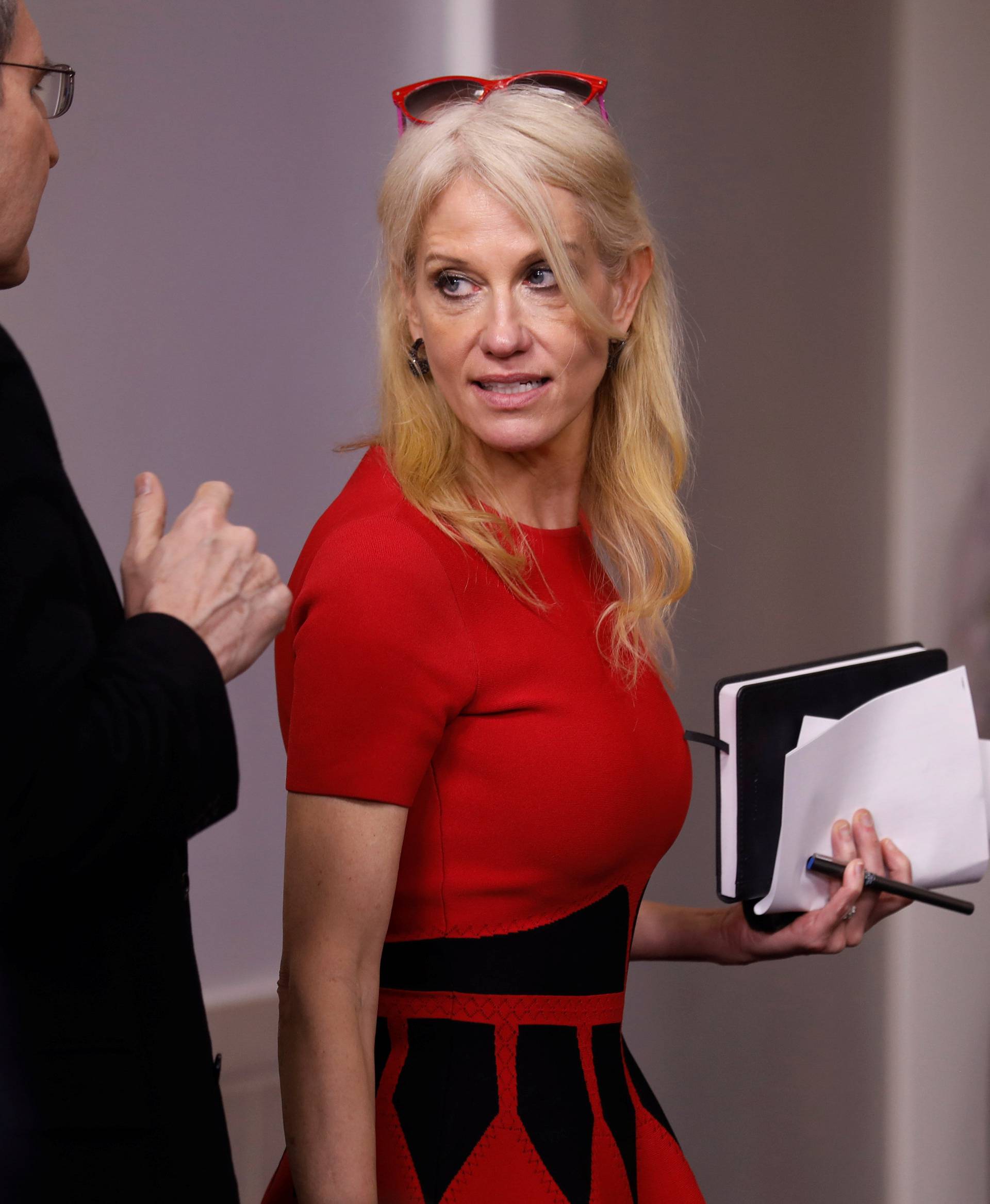 Conway speaks with reporters after the daily press briefing at the White House in Washington