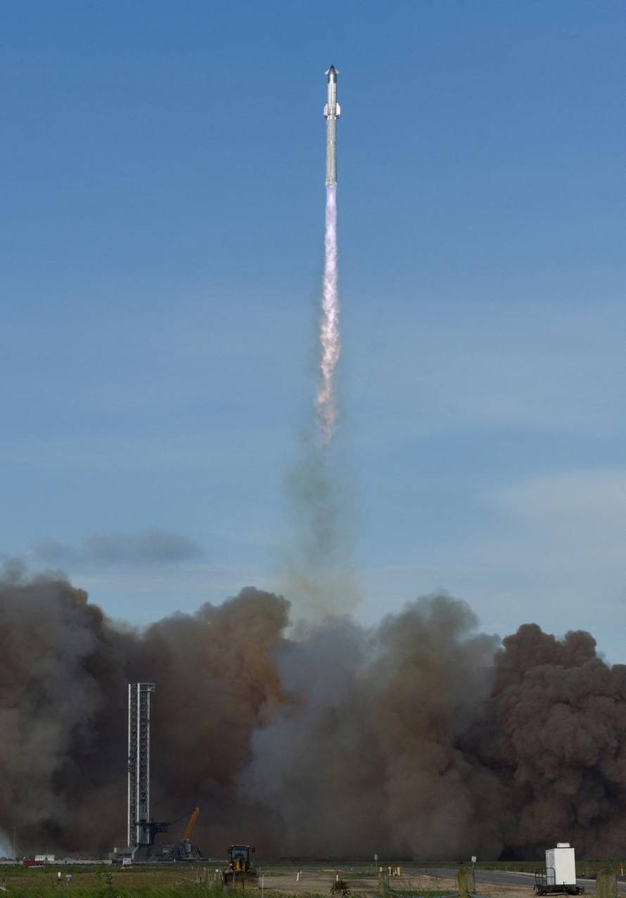 A SpaceX Super Heavy booster carrying the Starship spacecraft lifts off on its 10th test flight