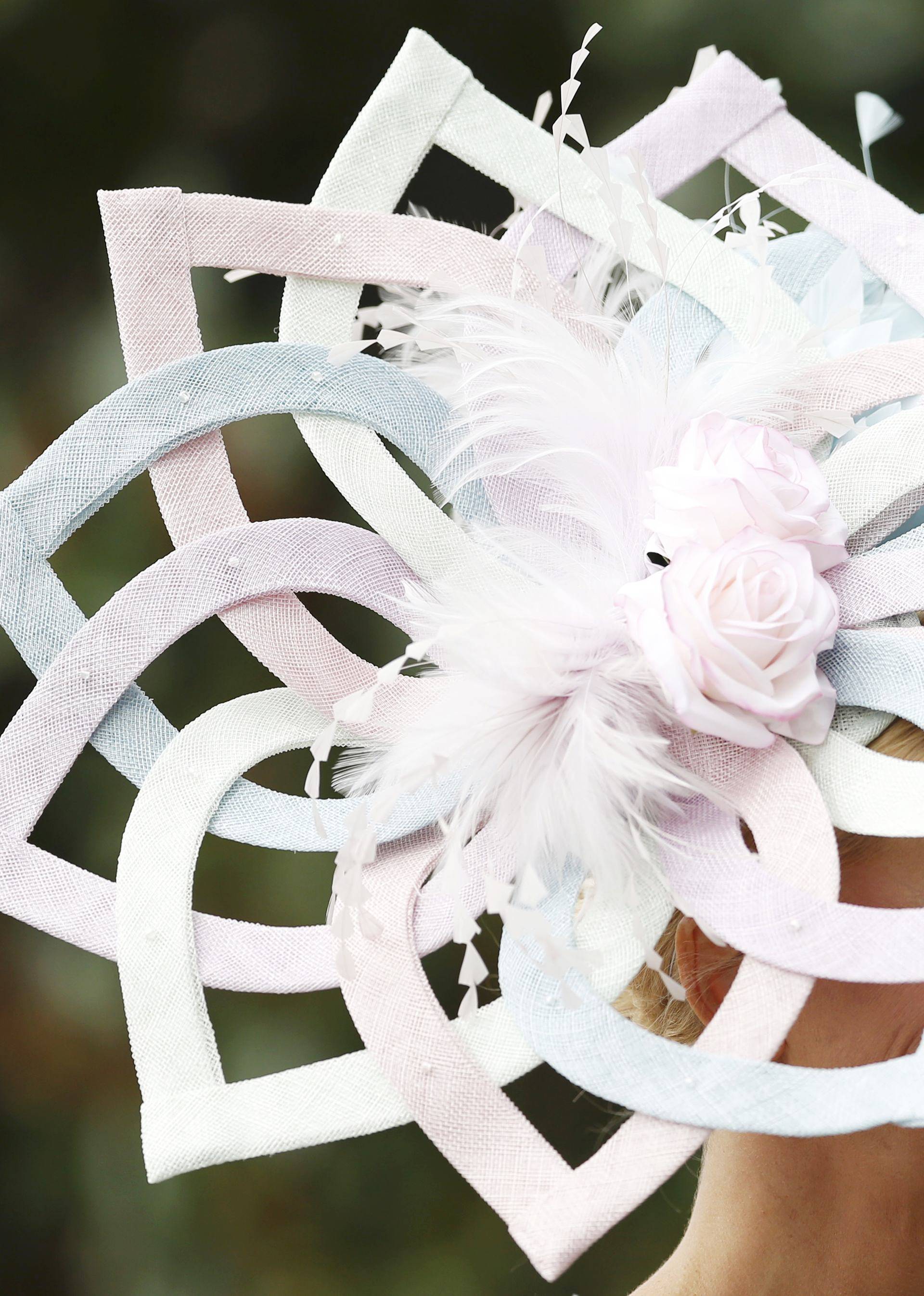 Britain Horse Racing Ladies Day Racegoer wears hat