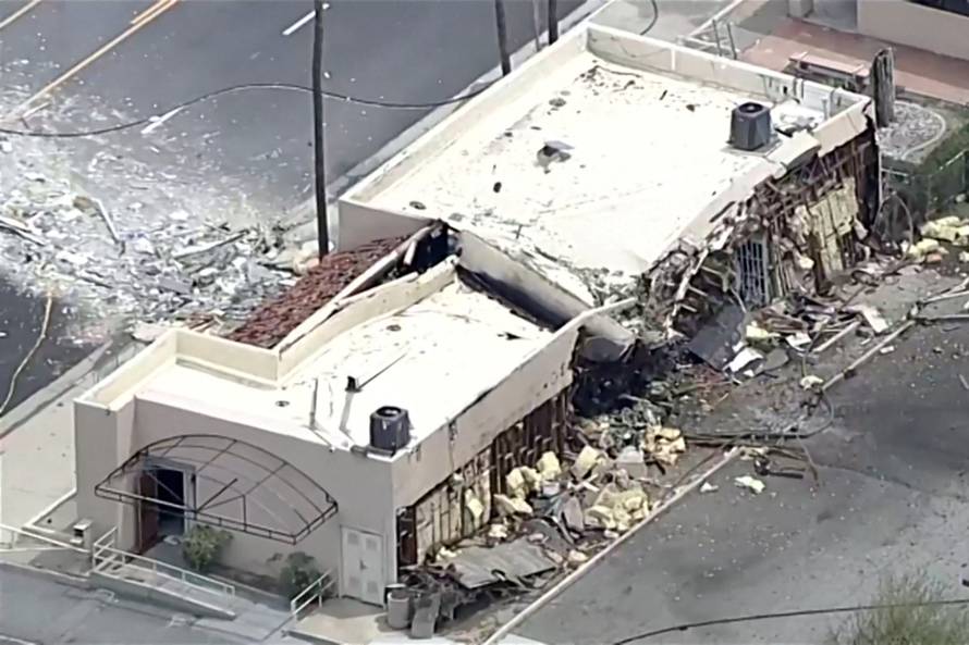 Debris is spilled onto the street after what the Mayor described as a bomb exploded in Palm Springs