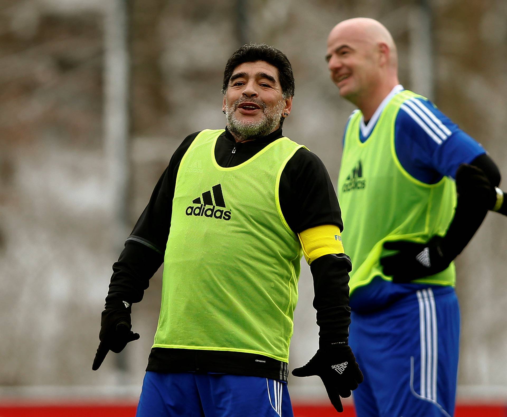 Maradona stands in front of FIFA President Infantino during the FIFA Legends tournament in Zurich