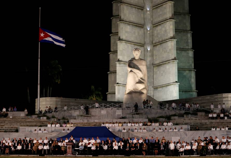 The Cuban flag flies at half-mast as dignitaries gather for a massive tribute to Cuba's late President Fidel Castro in Revolution Square in Havana