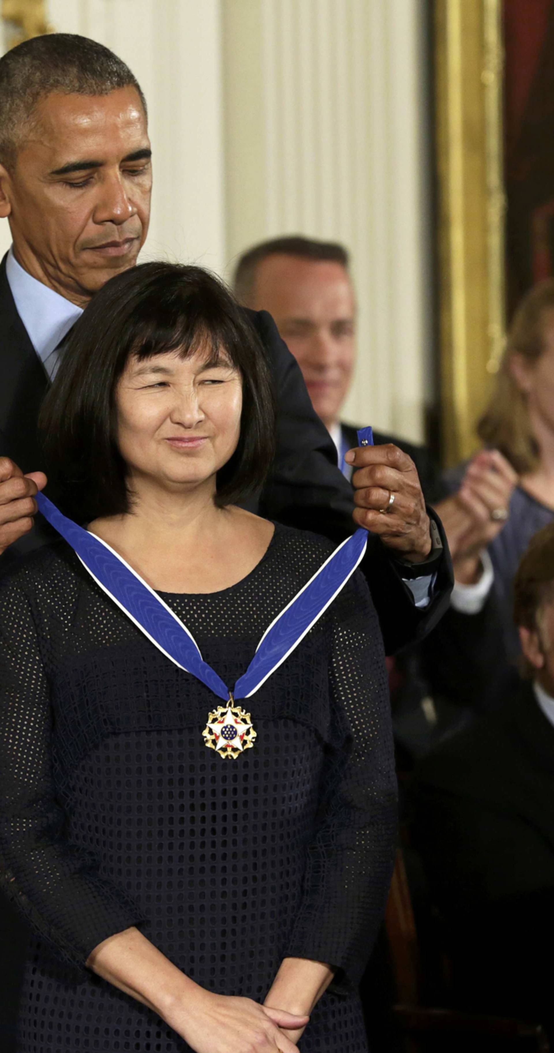 President Obama puts Presidential Medal of Freedom on artist Lin at White House in Washington