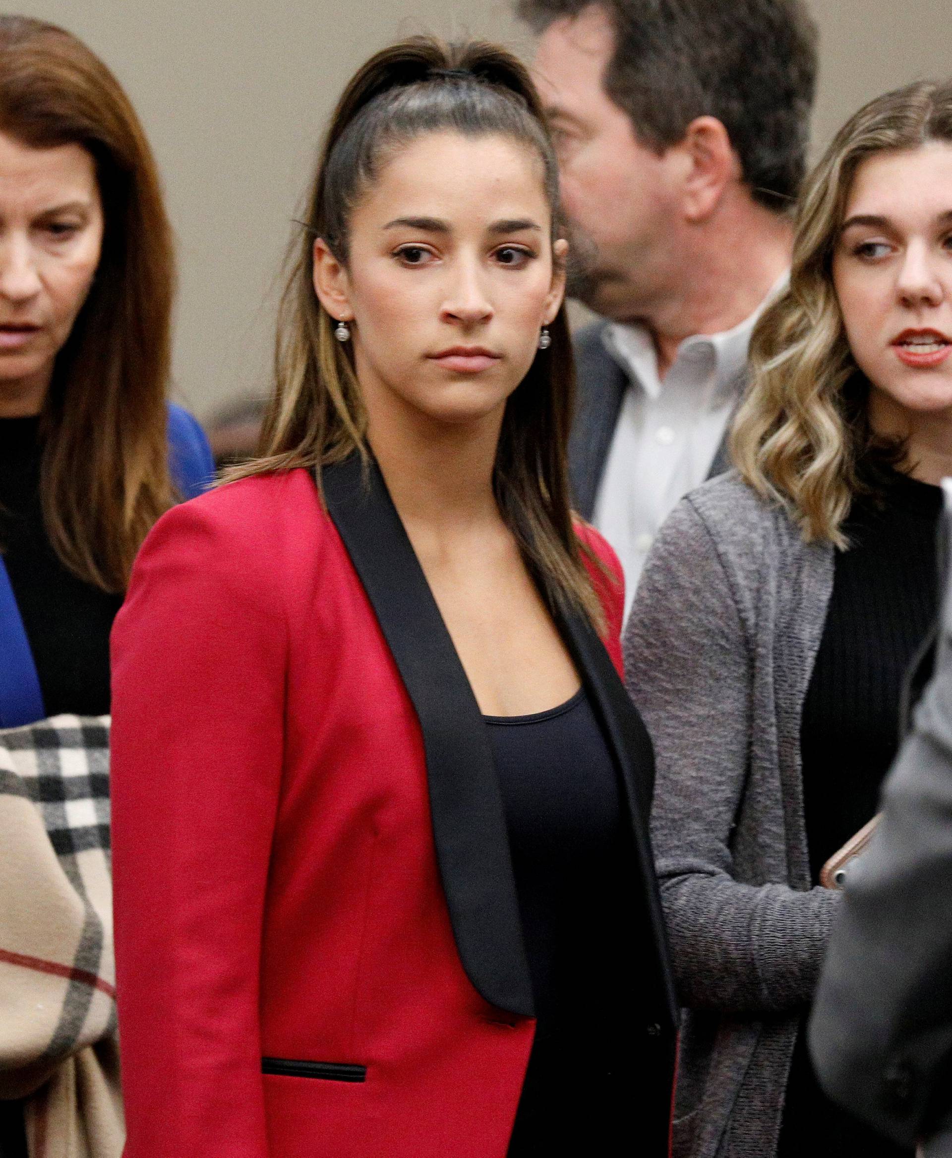 Victim and Olympic gold medalist Aly Raisman appears before speaking at the sentencing hearing for Larry Nassar, a former team USA Gymnastics doctor who pleaded guilty in November 2017 to sexual assault charges, in Lansing