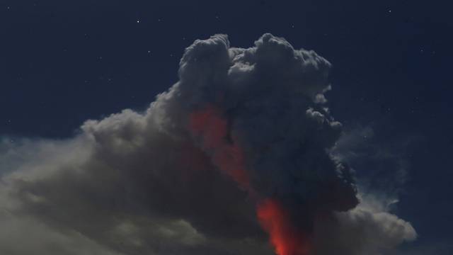 Mount Agung volcano erupts during the night, as seen from Datah village, Karangasem Regency in Bali